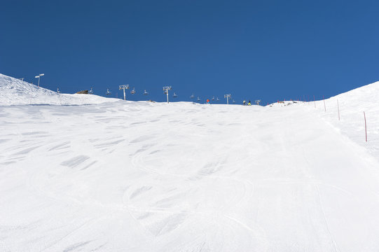 Snowy ski piste on a mountain