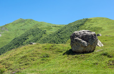 green hills in Murqmeli - one of four villages community called Ushguli in Upper Svanetia region, Georgia