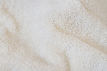 Beige background of plush fabric