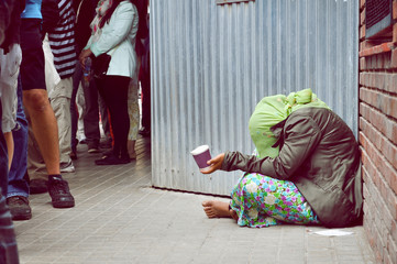 Homeless girl is begging for money
