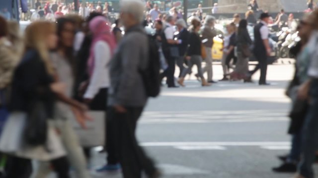Unfocused pedestrians crossing a street in the city of Barcelona. Slow Motion.(07)
