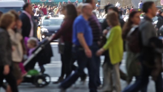 Unfocused pedestrians crossing a street in the city of Barcelona.(06)