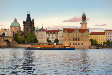 Prague, historical buildings next to Charles Bridge across the r