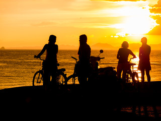 Fototapeta na wymiar People at Sunset on the beach of Ao Nang in Krabi