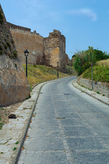Fototapeta na wymiar Road among the ruins of the old castle