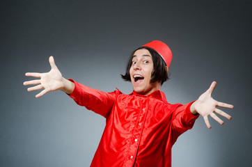 Man wearing red fez hat