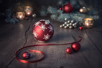 Christmas arrangement in red and green on wooden table