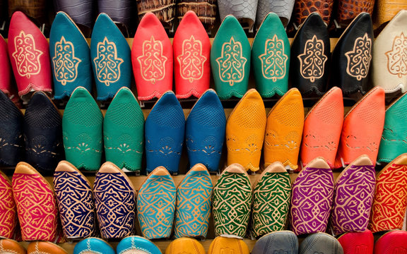 Many slippers colorful for sale in the souk of Marrakech, Morocco
