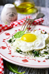 Rice with spinach and fried egg.