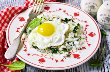 Rice with spinach and fried egg.