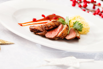roasted duck breast on Christmas table