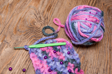 multicolor ball of yarn and knitting