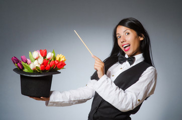Woman magician in funny concept