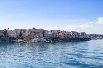Fototapeta na wymiar Corfu island cityscape from the sea with blue waters and sky.