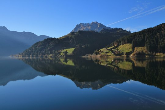 Mountains and forest reflecting in lake Wagital