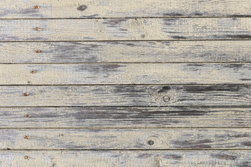 Fototapeta premium old board with the remains of a light yellow paint