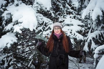 Fototapeta na wymiar Winnter girl and snow fir tree.