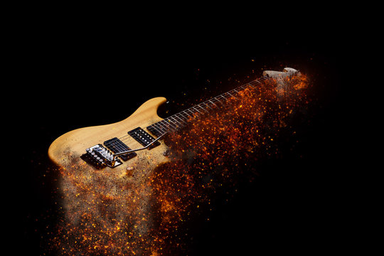 Electric Guitar in fire Isolated on Black