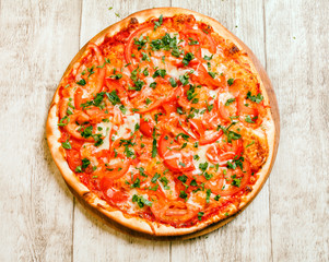 pizza on the wood background