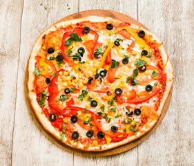 pizza on the wood background