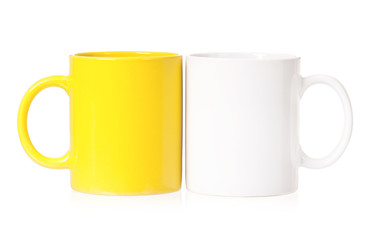 Yellow and white mugs for coffee or tea