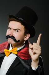 Funny magician man wearing tophat