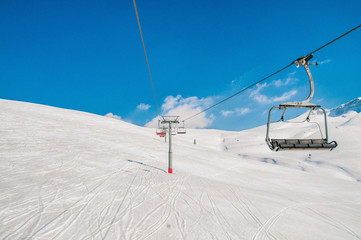 Ski lifts durings bright winter day