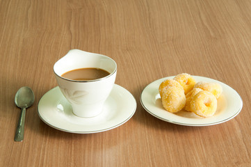 a cup of coffee and donus