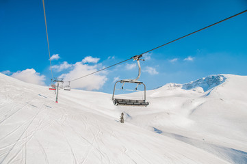 Ski lifts durings bright winter day