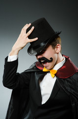 Funny magician man wearing tophat