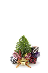 Stock Photo:.Christmas card with fir and decor on glitter backgr