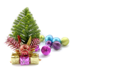 Stock Photo:.Christmas card with fir and decor on glitter backgr