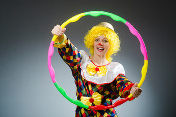 Clown in funny concept on dark background
