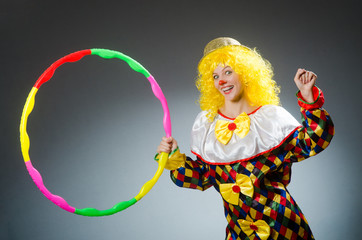 Clown in funny concept on dark background