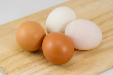 Eggs on wood background.