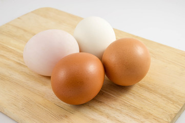 Eggs on wood background.