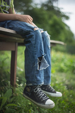 feet of a homeless man in dirty, torn jeans Stock Photo | Adobe Stock