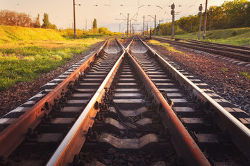 Fototapeta premium Cargo train platform at sunset. Railroad. Railway station