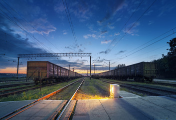 Cargo train platform at night. Railroad in Ukraine. Railway stat