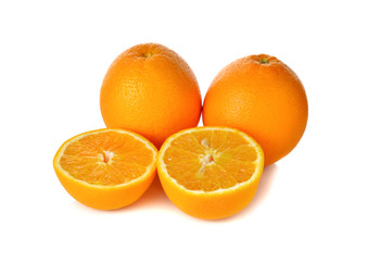 whole and cut ripe orange on white background