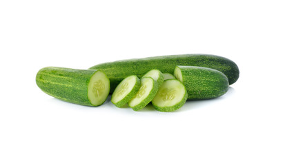 whole and sliced fresh cucumber on white background