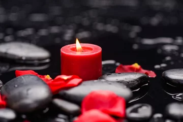 Rolgordijnen Still life with red rose petals with candle and therapy stones  © Mee Ting