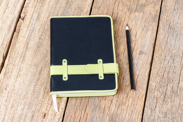 Leather notebooks on wooden background