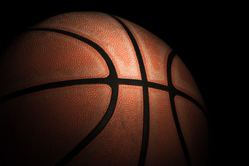 Close up of old basketball on dark background