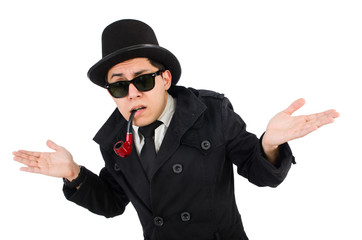 Young detective in black coat holding magnifying glass isolated 