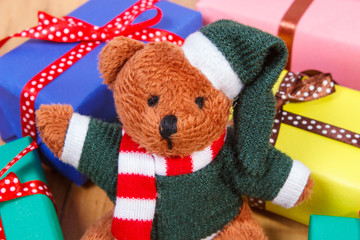 Teddy bear with colorful gifts for Christmas or other celebration