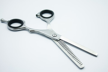 professional scissors for haircuts on white background