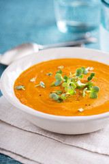 Curried carrot soup with cream and herbs