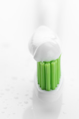 Fototapeta na wymiar Toothbrush with toothpaste close-up