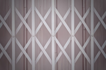 Pink metal grille sliding door with aluminium handle